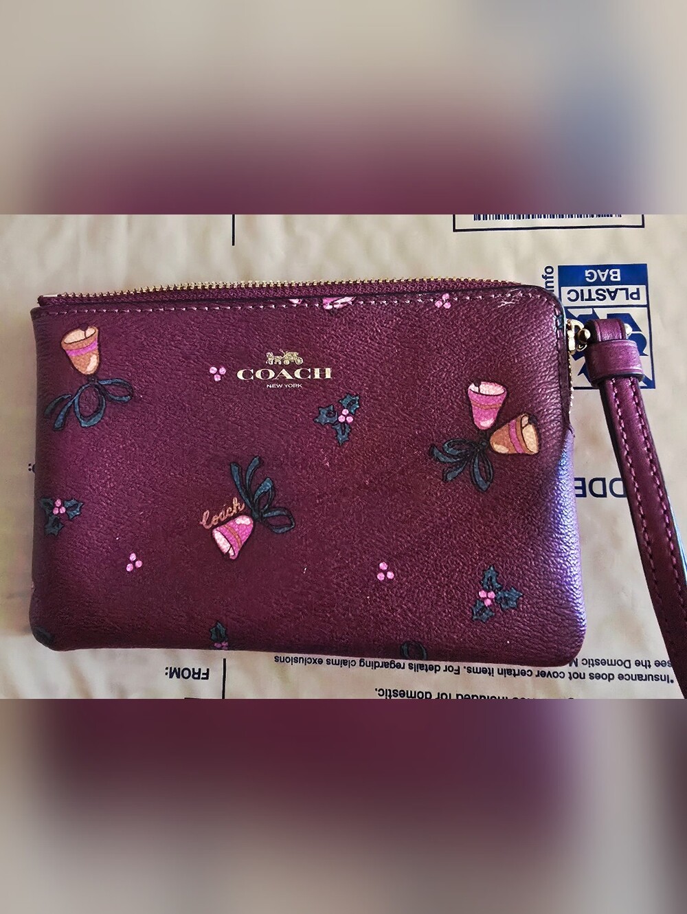 Coach Black Cherry Holiday Bells & Mistletoe Wristlet with Gold Logo 0233